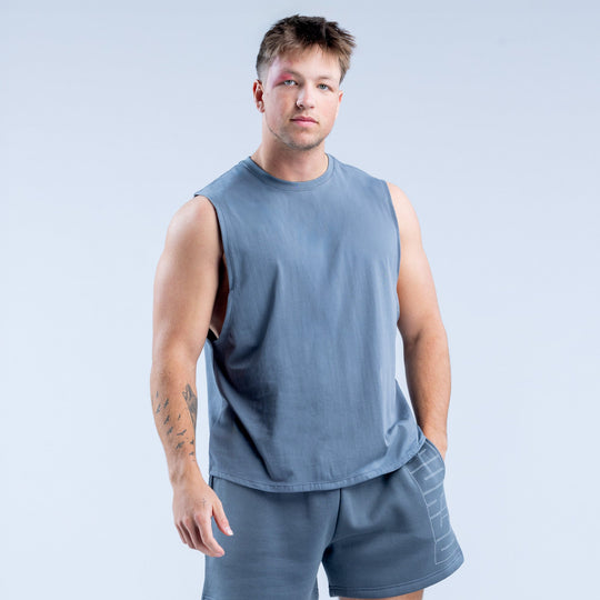 Men's blue sleeveless crew-neck graphic tank top, solid front