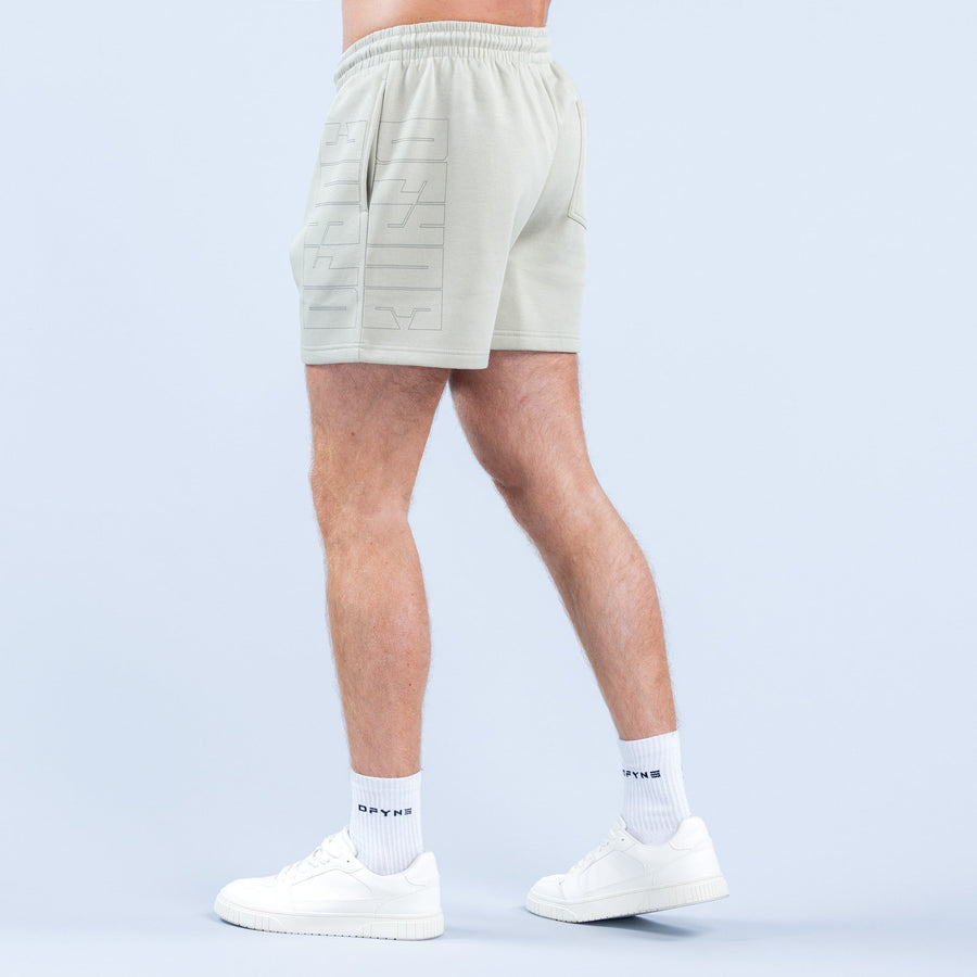 Light green graphic shorts, side back view with embossed logo patch