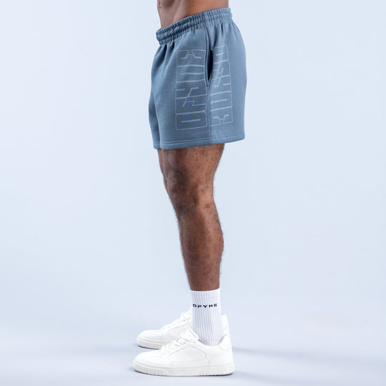 Men's denim-blue graphic shorts, side view, elastic waistband and printed logo