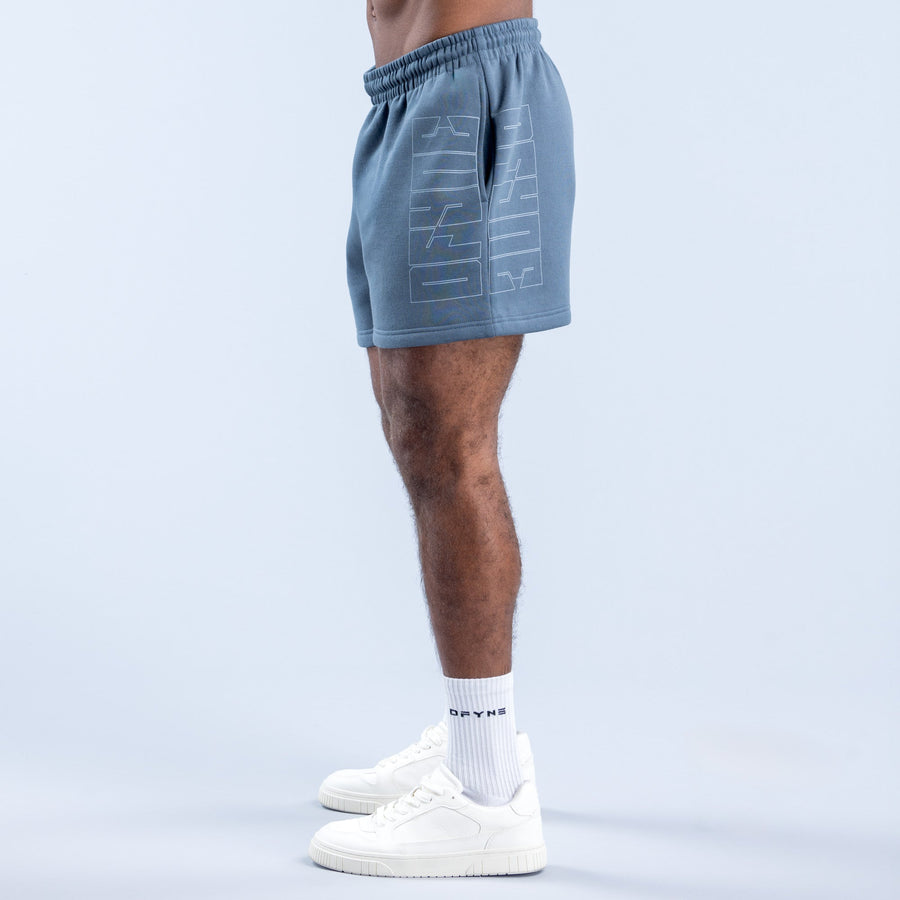 Men's denim-blue graphic shorts, side view, elastic waistband and printed logo