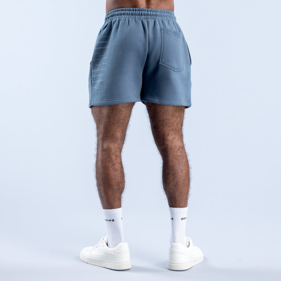 Men's denim-blue graphic shorts, back view, elastic waistband and side pocket