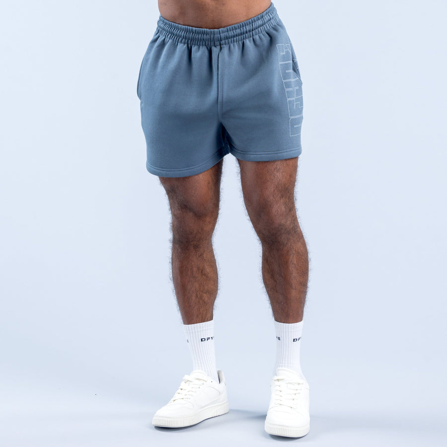 Men's denim-blue graphic shorts with elastic waistband and side logo print