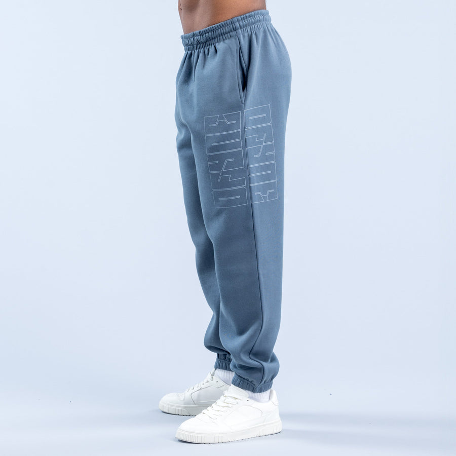 Blue graphic jogger pants with elastic waist, cuffed hems, and vertical side print