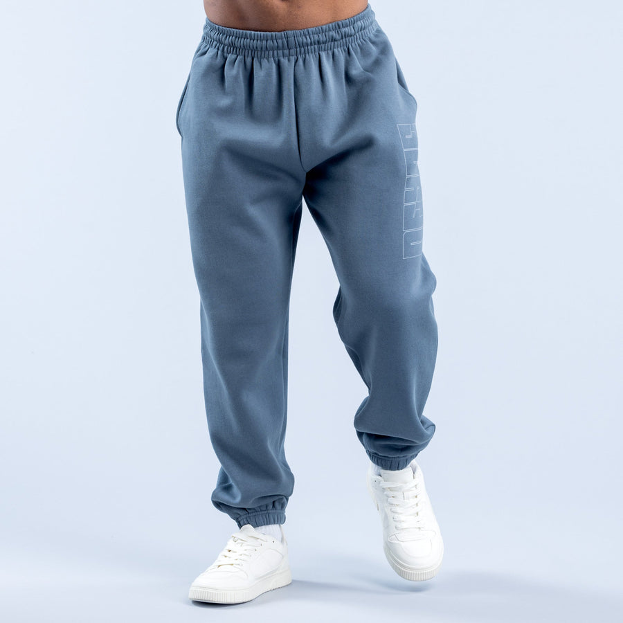 Blue graphic jogger pants with elastic waistband, tapered cuffs, and side print