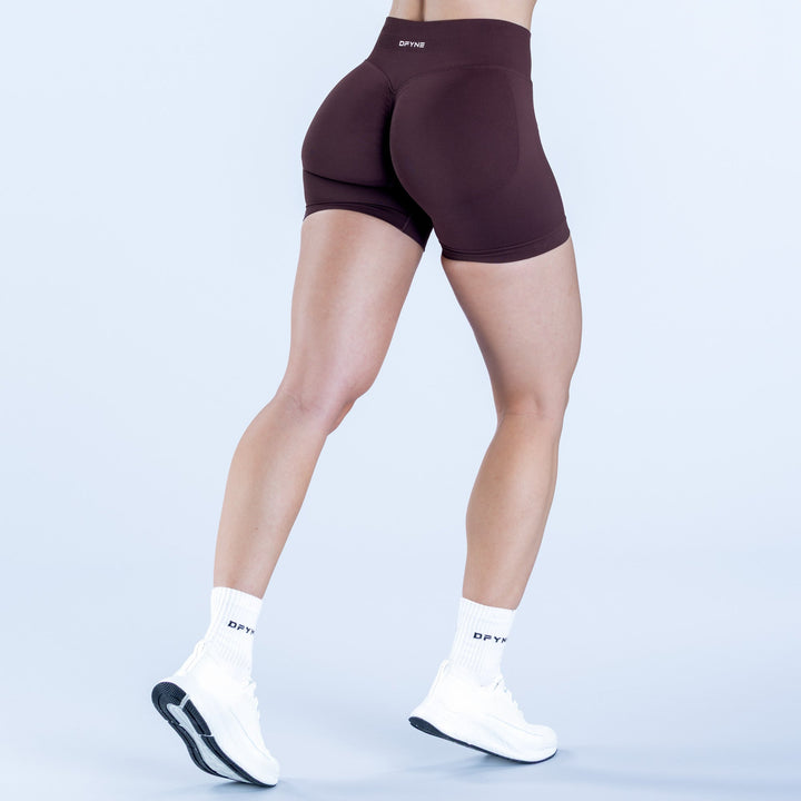 4.5-inch dark plum shorts with curved back panel and stitched hem
