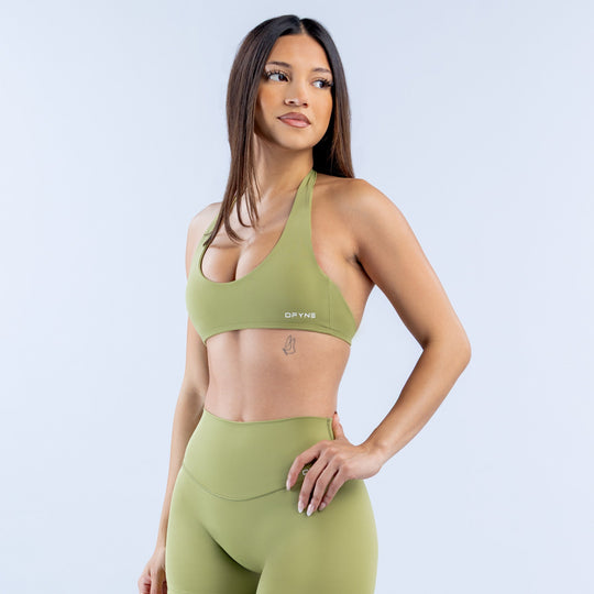 Green halter bra with racerback cutout and supportive front coverage