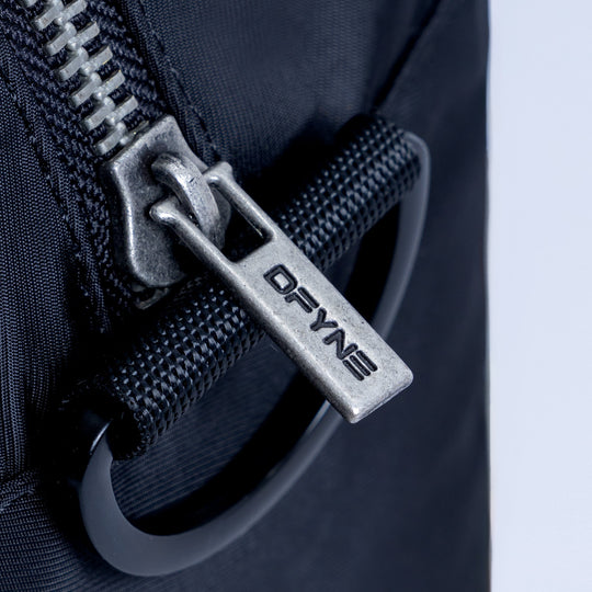 Mini duffle bag metal zipper pull on textured zipper track