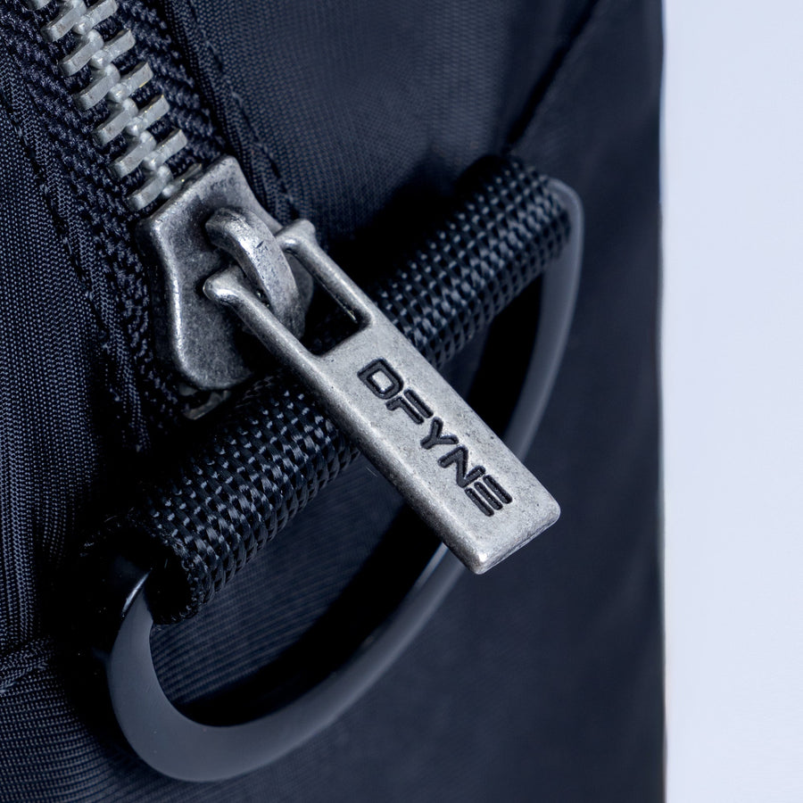 Mini duffle bag metal zipper pull on textured zipper track
