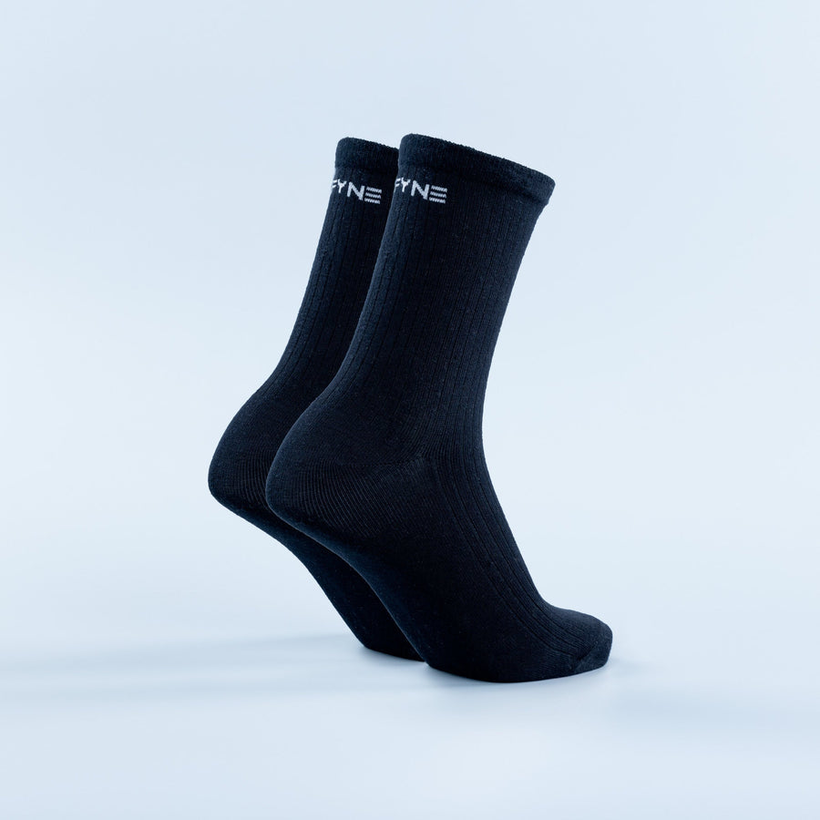 Dark navy crew socks with ribbed knit and small logo at the cuff