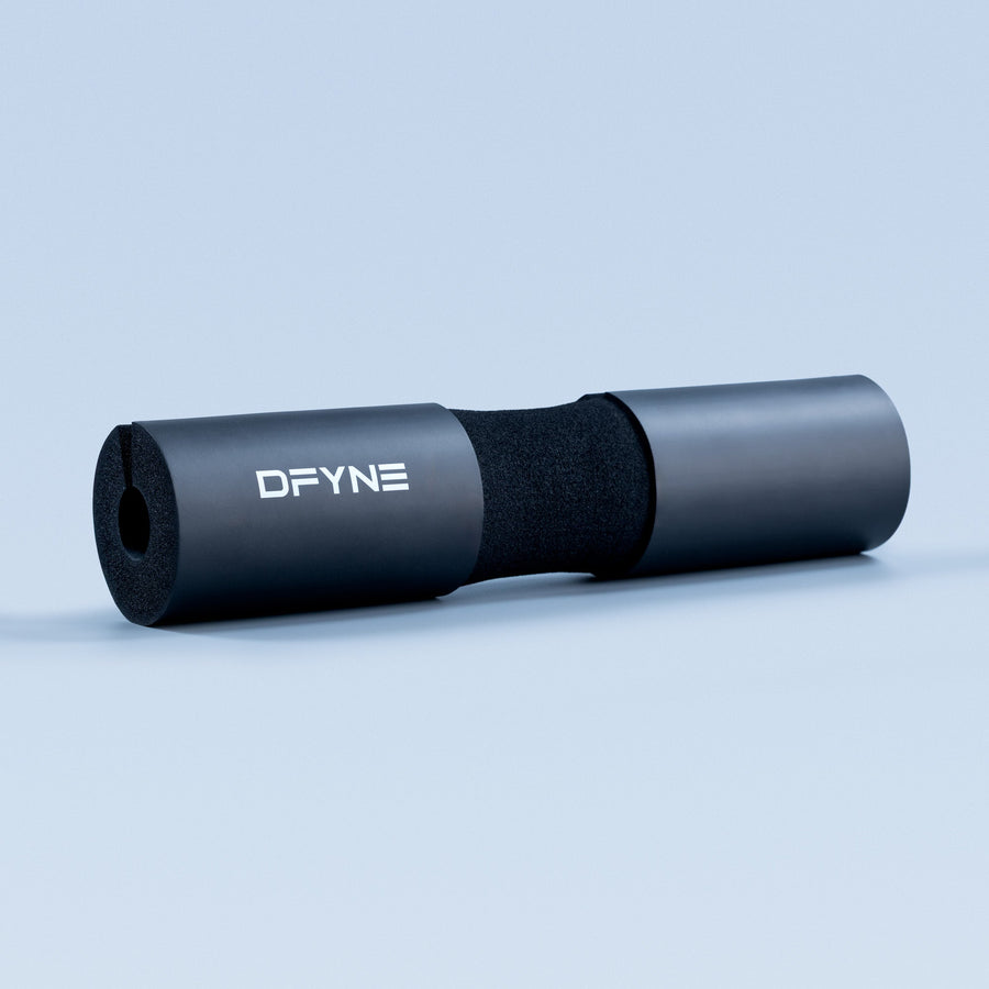 Black barbell pad with DFYNE logo, foam core and cylindrical sleeve