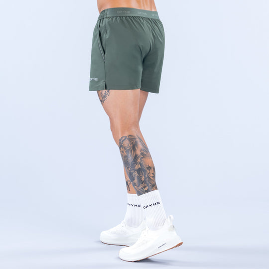 4-in training shorts, dark green with elastic waistband and side seam detail