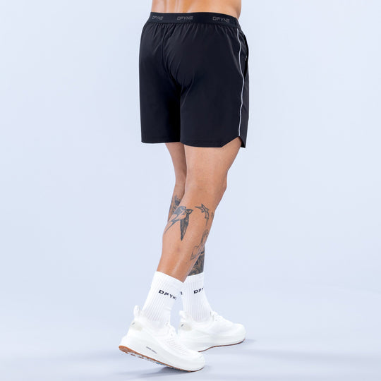 6-inch black training shorts, back view, elastic waistband and logo at hem