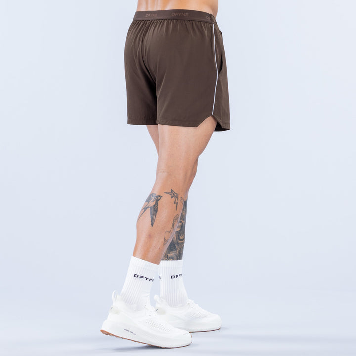 Men's dark brown 4-inch training shorts with elastic waistband, back view