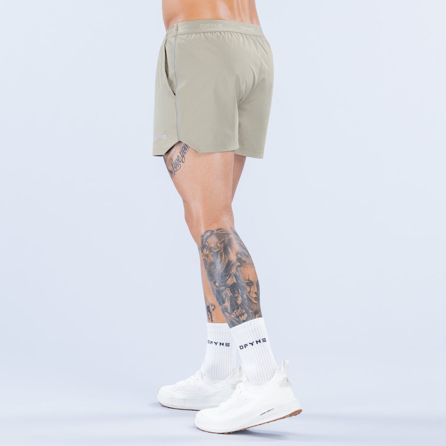 Olive 4-inch training shorts side view with elastic waistband and back seam