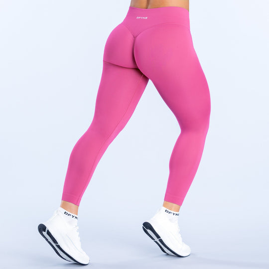 Fuchsia back view leggings with raised yoke and smooth, stretchy fabric