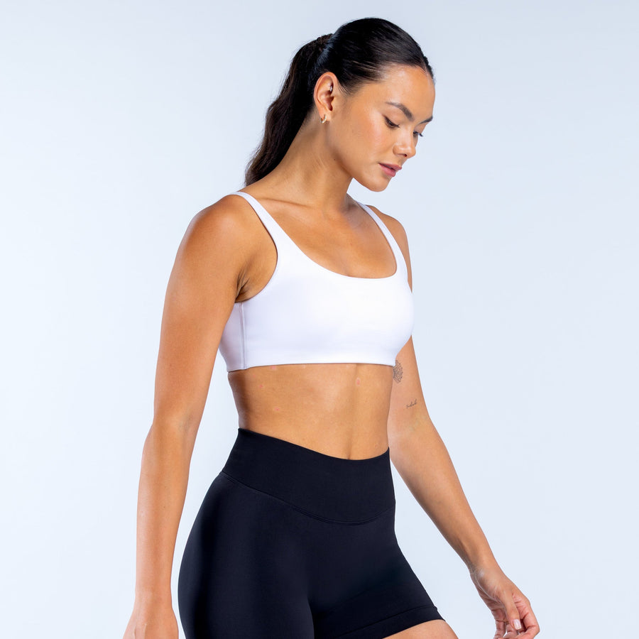 White sports bra with scoop neckline and smooth stretch fabric