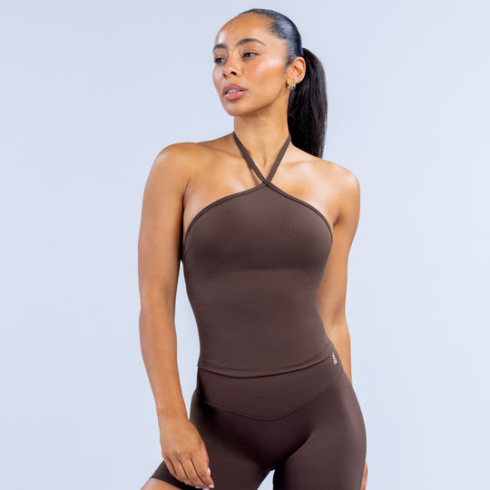 Dark longline halter top with halter neckline and smooth fitted silhouette