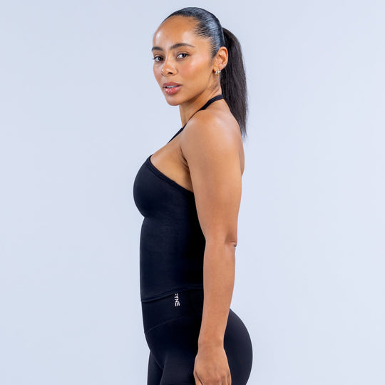 Black longline halter top in side profile with cross halter straps