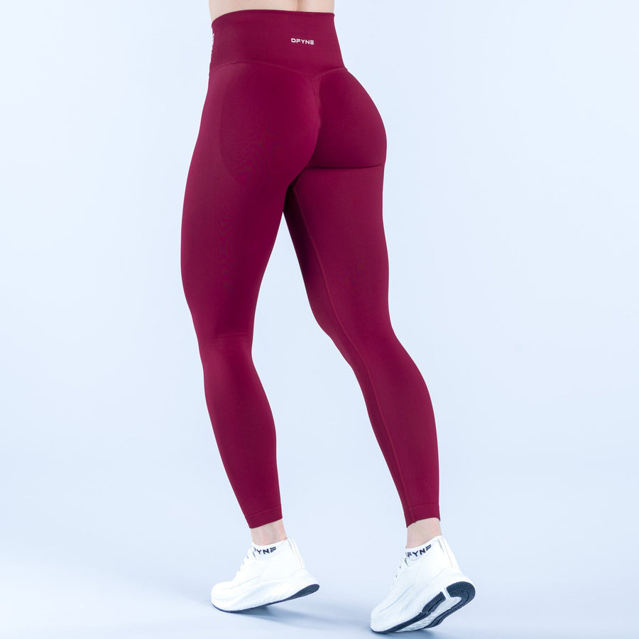 Burgundy dynamic leggings with high-rise waistband and smooth stretch fabric
