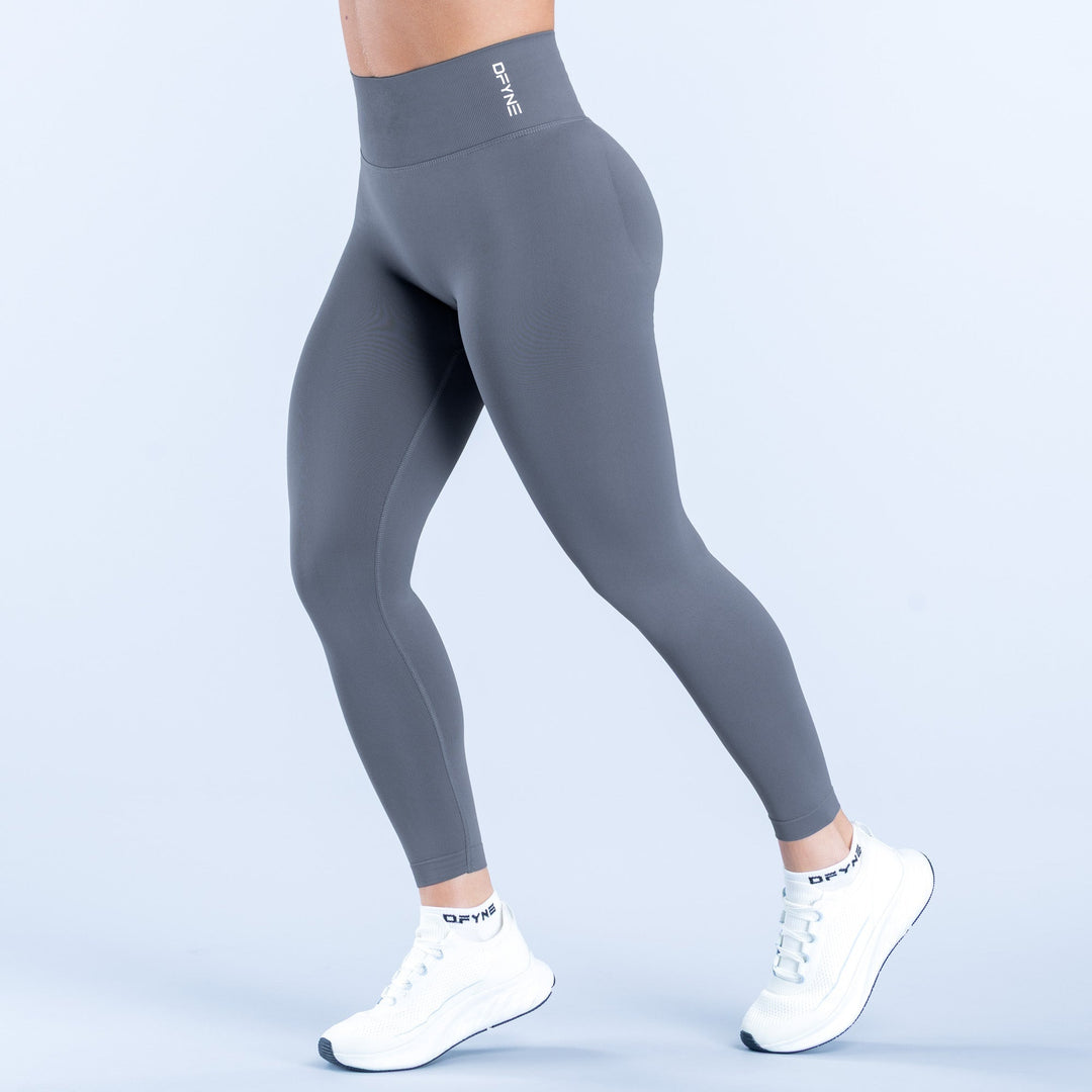 Dark gray leggings, ankle length, wide waistband, side logo detail
