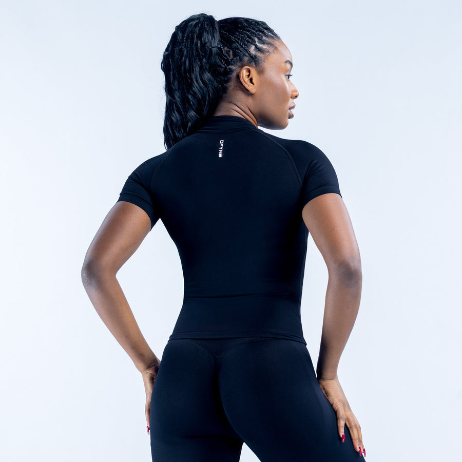 Black short-sleeve zip-up athletic top with mock neck, back view