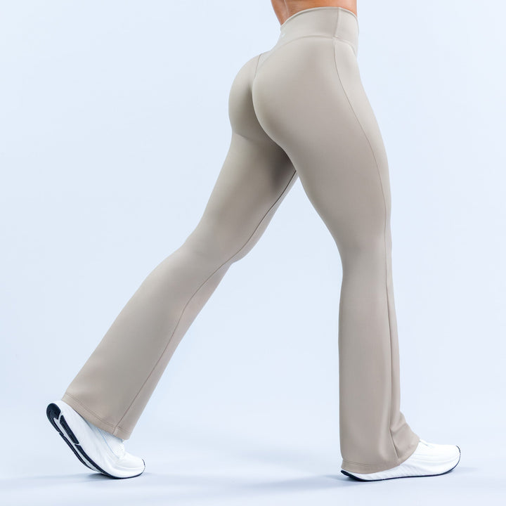 Light gray high-rise flared leggings with back seam detail and full-length bell