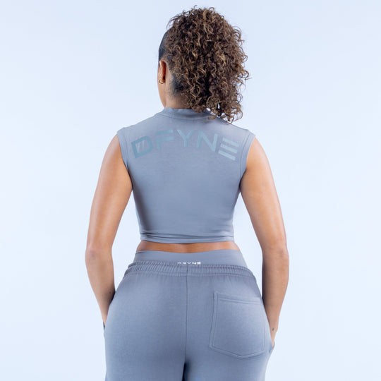 Gray sleeveless cropped baby tee with crew neck and printed logo on back