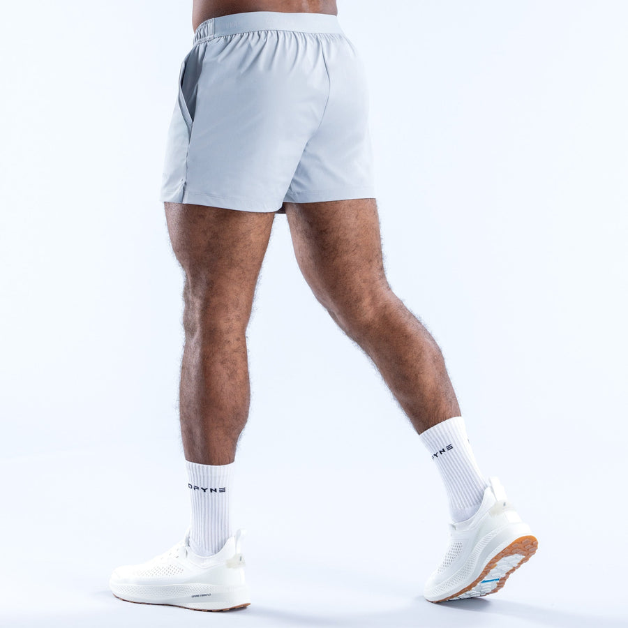 Men's light blue training shorts, 4-in inseam, back view, elastic waistband