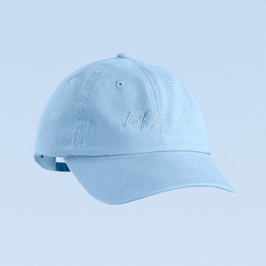 Light blue baseball cap with script logo embroidery and curved brim