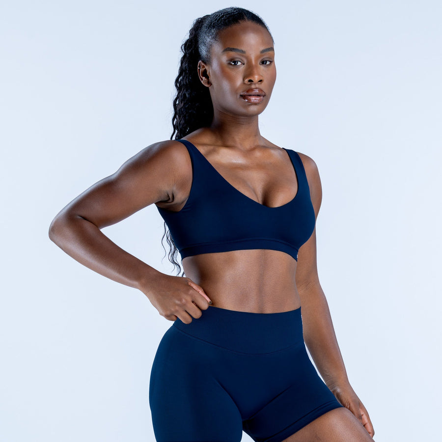 Navy scoop-back sports bra with mid-support fit and scoop neckline