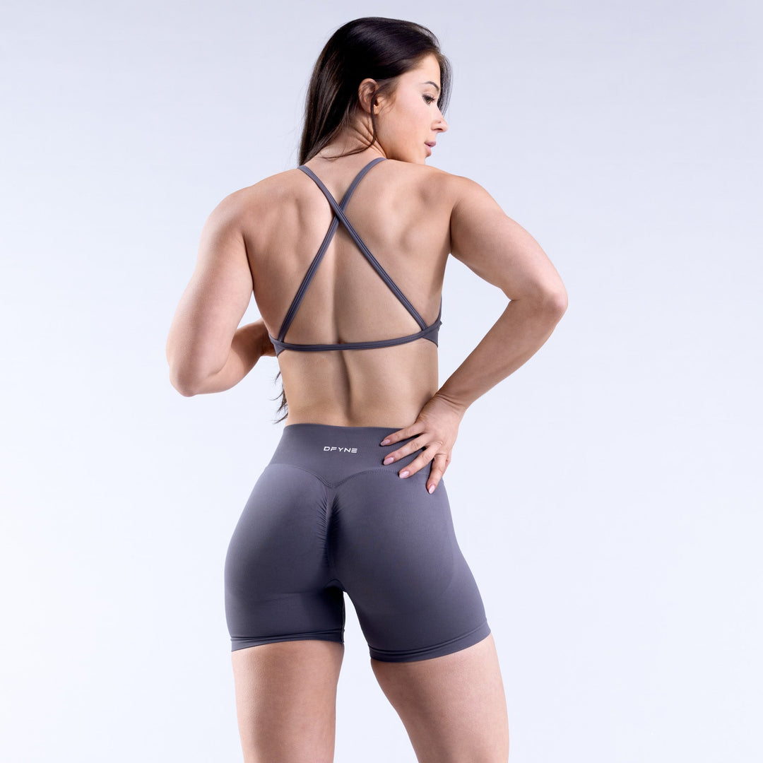 Back view of high-neck backless sports bra with crisscross straps, dark gray