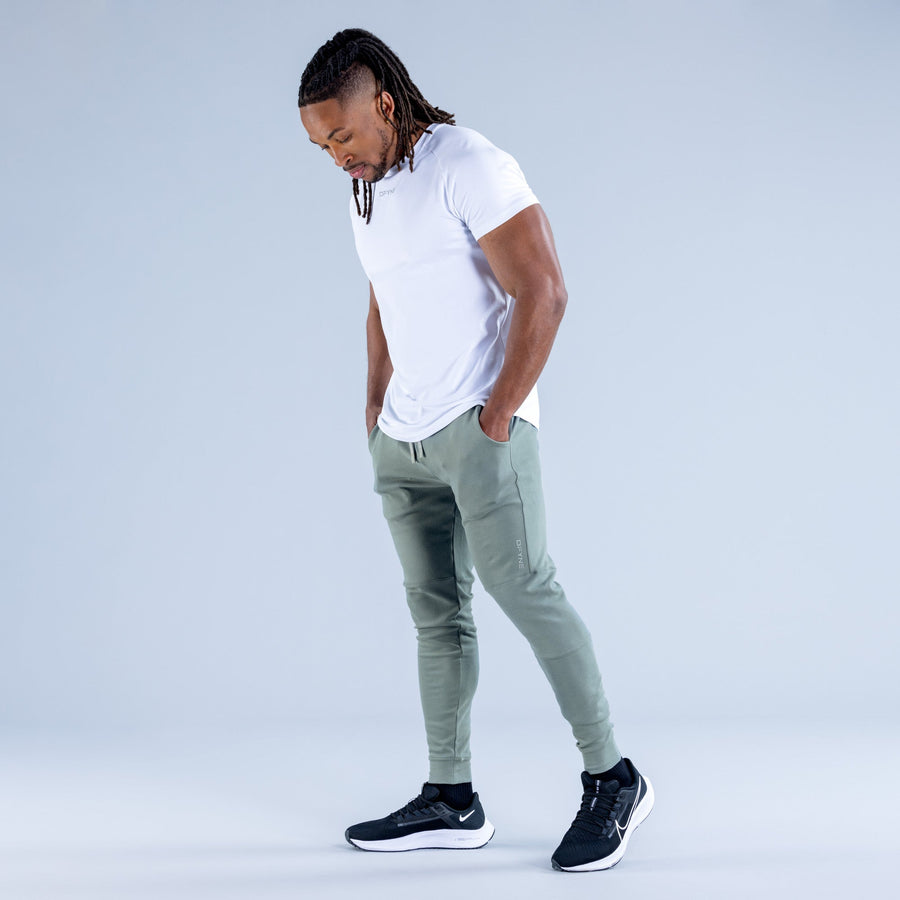 Sage green tapered jogger pants with drawstring waist and side pockets