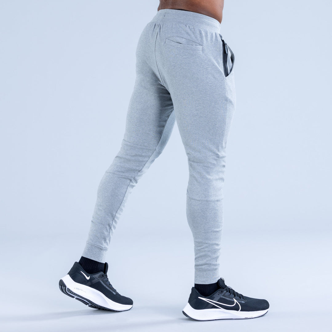 Light gray jogger pants, back view, with drawstring and tapered ankle cuffs