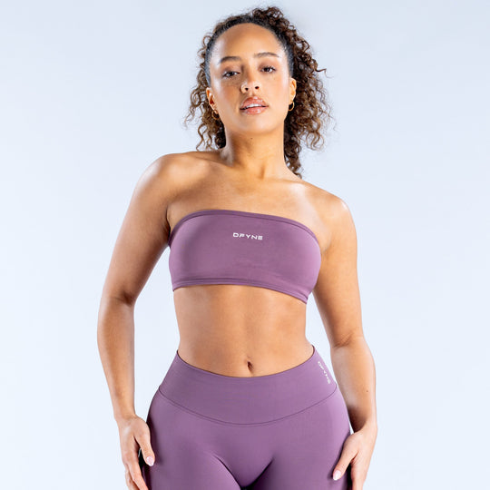 Purple backless bandeau sports bra with wide band and DRYNE logo
