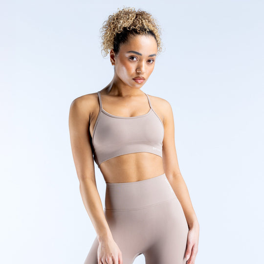 Taupe backless sports bra with adjustable straps and supportive scoop neckline