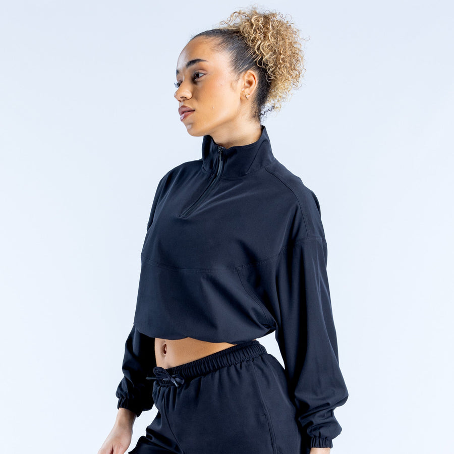 Black cropped zip-up jacket with high collar, quarter zip, elastic hem and cuffs