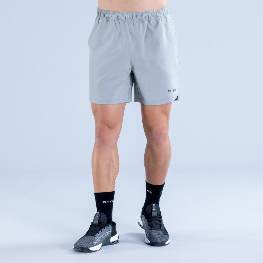 Men's light blue training shorts with straight hem and DPYNE logo near thigh