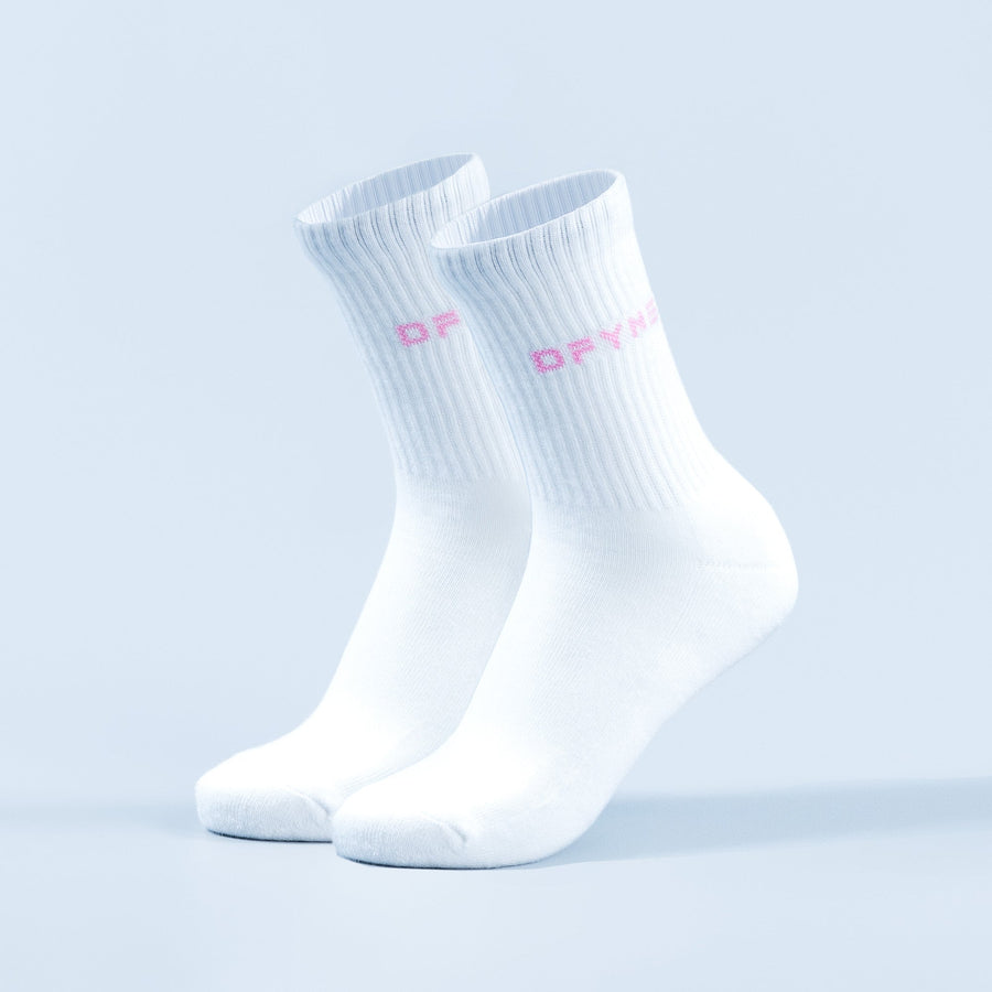 Pair of white crew socks with pink logo lettering on the ankle