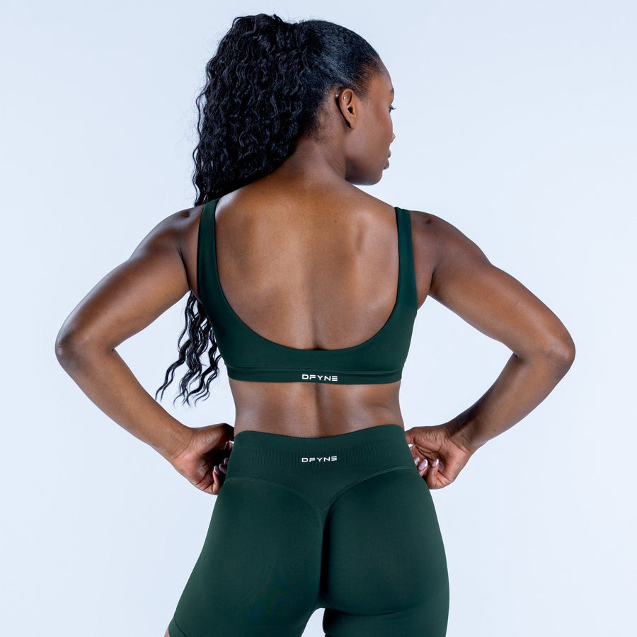 Dark green sports bra with open scoop back and racerback straps