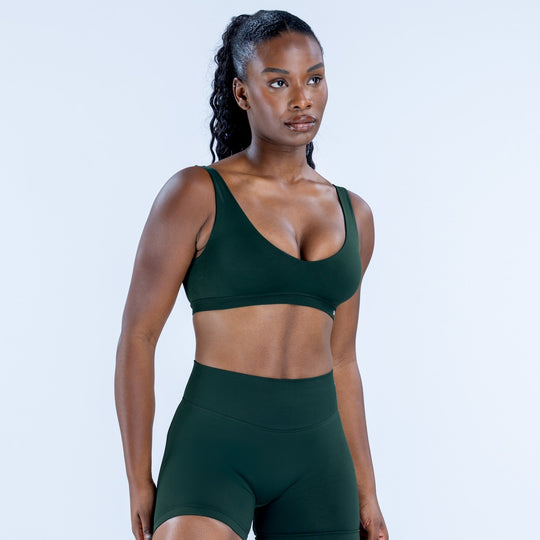 Impact scoop back bra in dark green with supportive V neckline and soft cups
