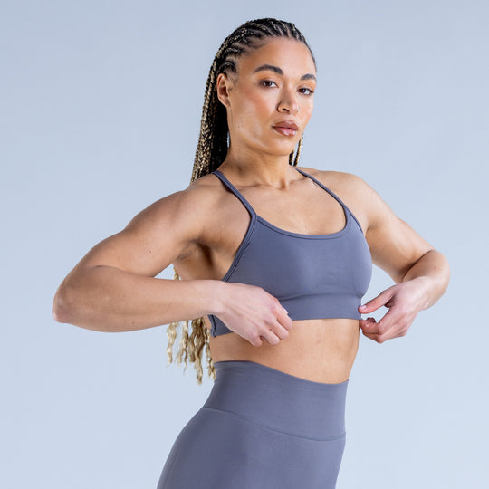 Dark blue-gray sports bra with scoop neckline and crisscross back