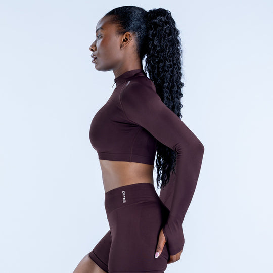 Maroon fitted crop jacket side view with quarter zip neck, long sleeves