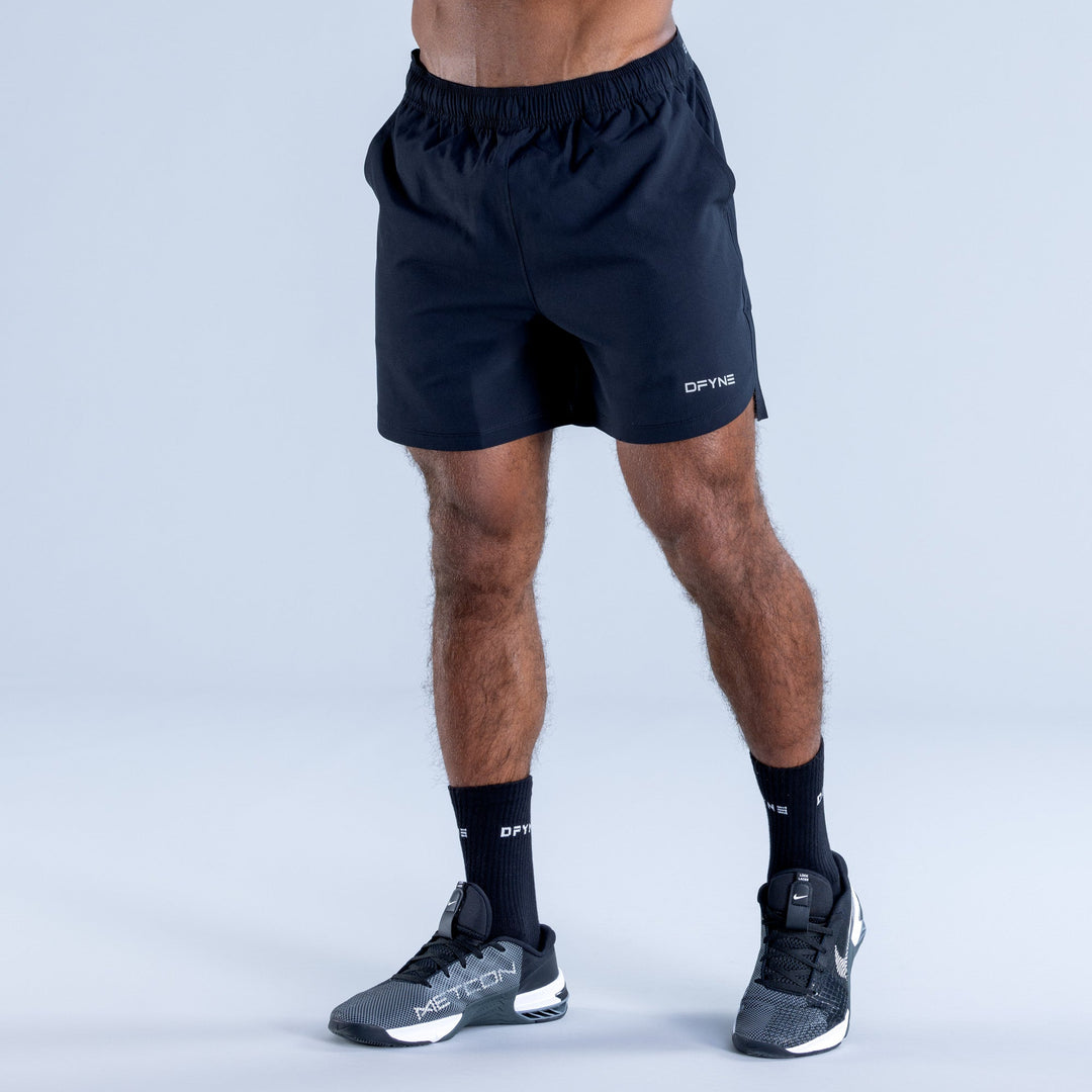 Dark navy training shorts with elastic waistband and side seams