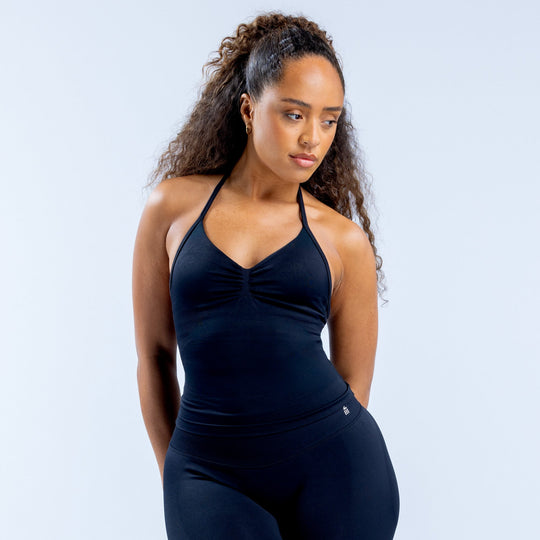 Dark navy longline strappy halter top with ruched center and clean fitted seams.