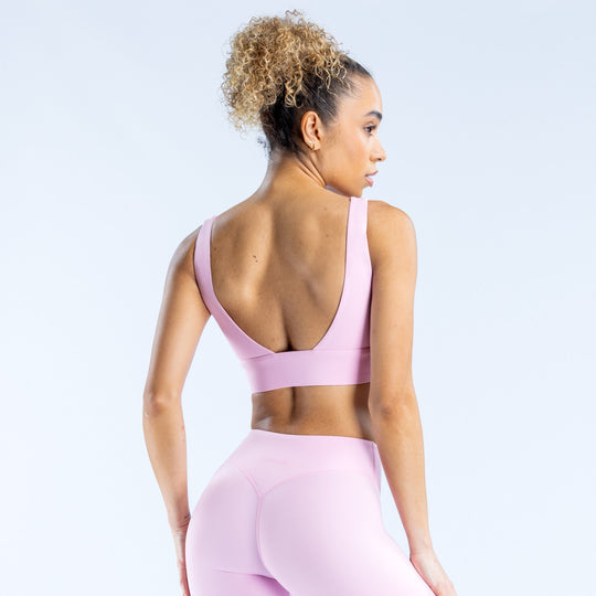 Lavender/pink sports bra racerback back view with wide straps and scoop neckline