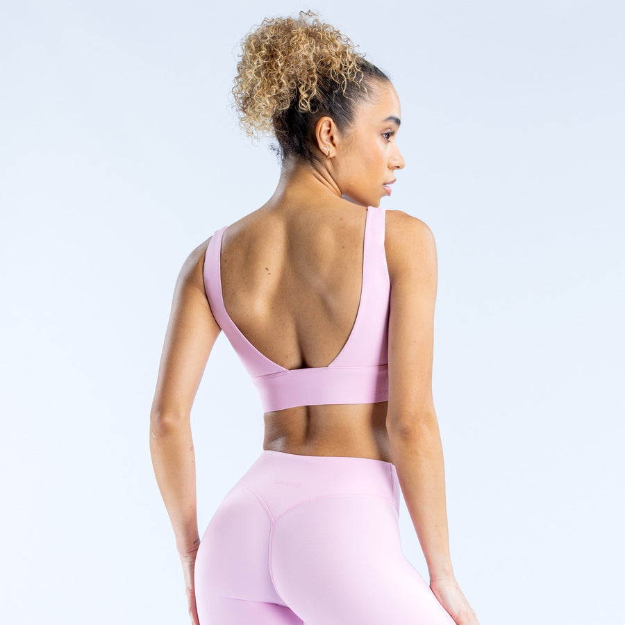 Lavender/pink sports bra racerback back view with wide straps and scoop neckline