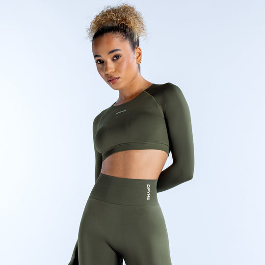 Olive green long-sleeve crop top with crew neck, snug fit, and chest logo
