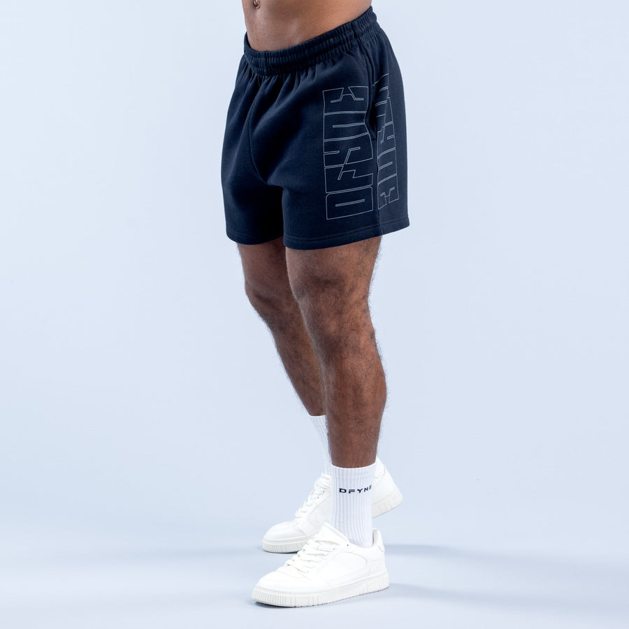 Navy graphic shorts with vertical abstract print on left leg