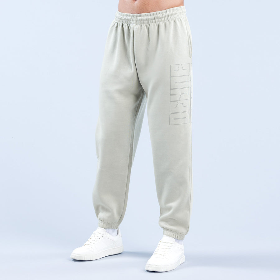 Cream joggers with vertical graphic on thigh and ribbed ankle cuffs