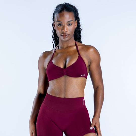 Impact strappy bra in maroon with underwire-style cups and thin halter straps